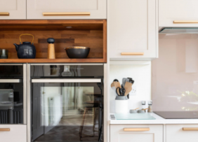 A white cabinet kitchen with rose gold cabinet hardware